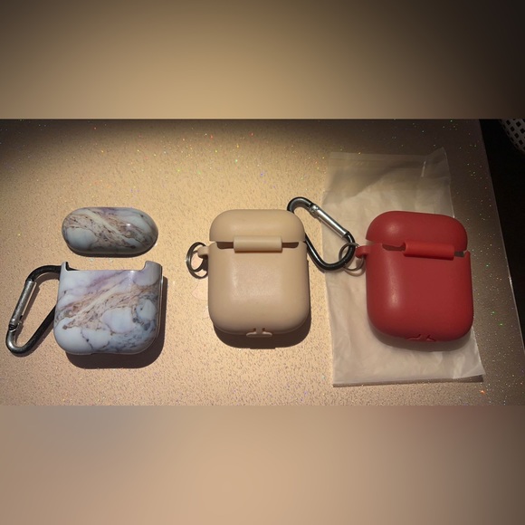 3 AirPod Cases. One hard cover and two silicones. Far right has never been used! - Picture 2 of 2